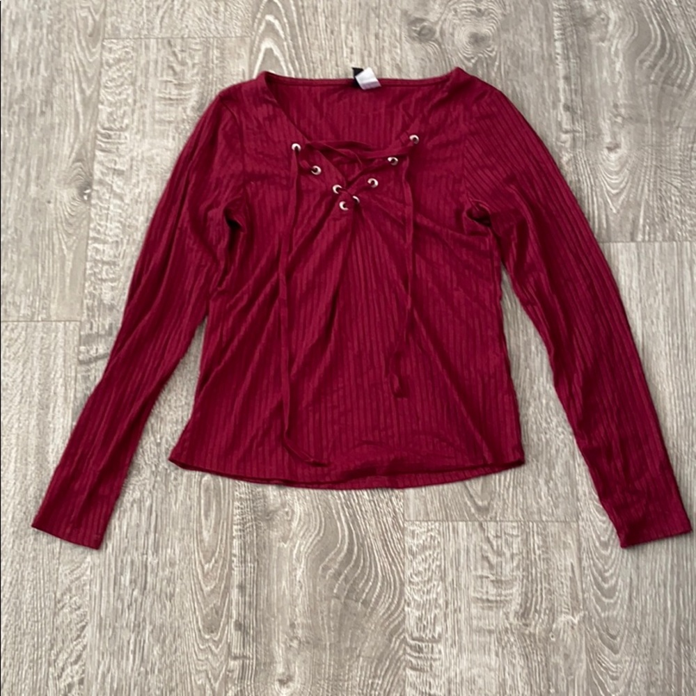 Top with shoelace type detail on the chest